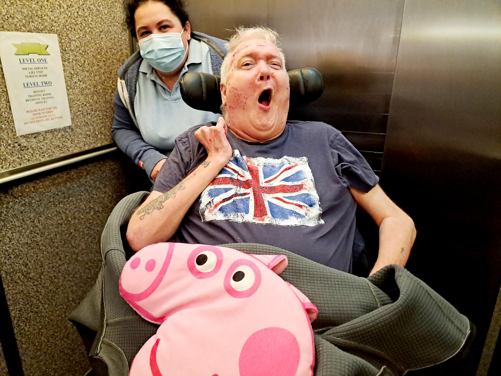 resident with Peppa Pig cushion 