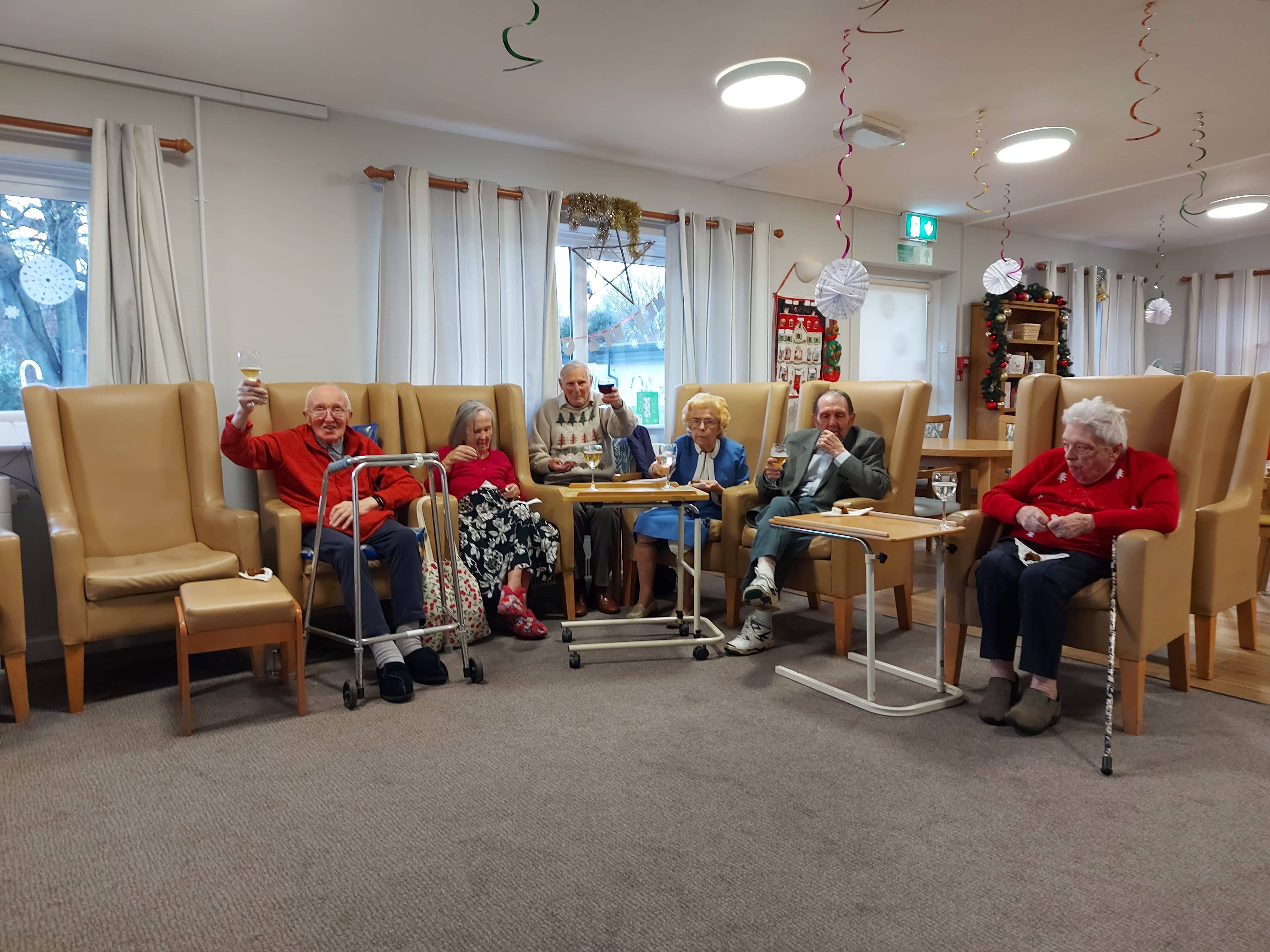 residents waving from sofas