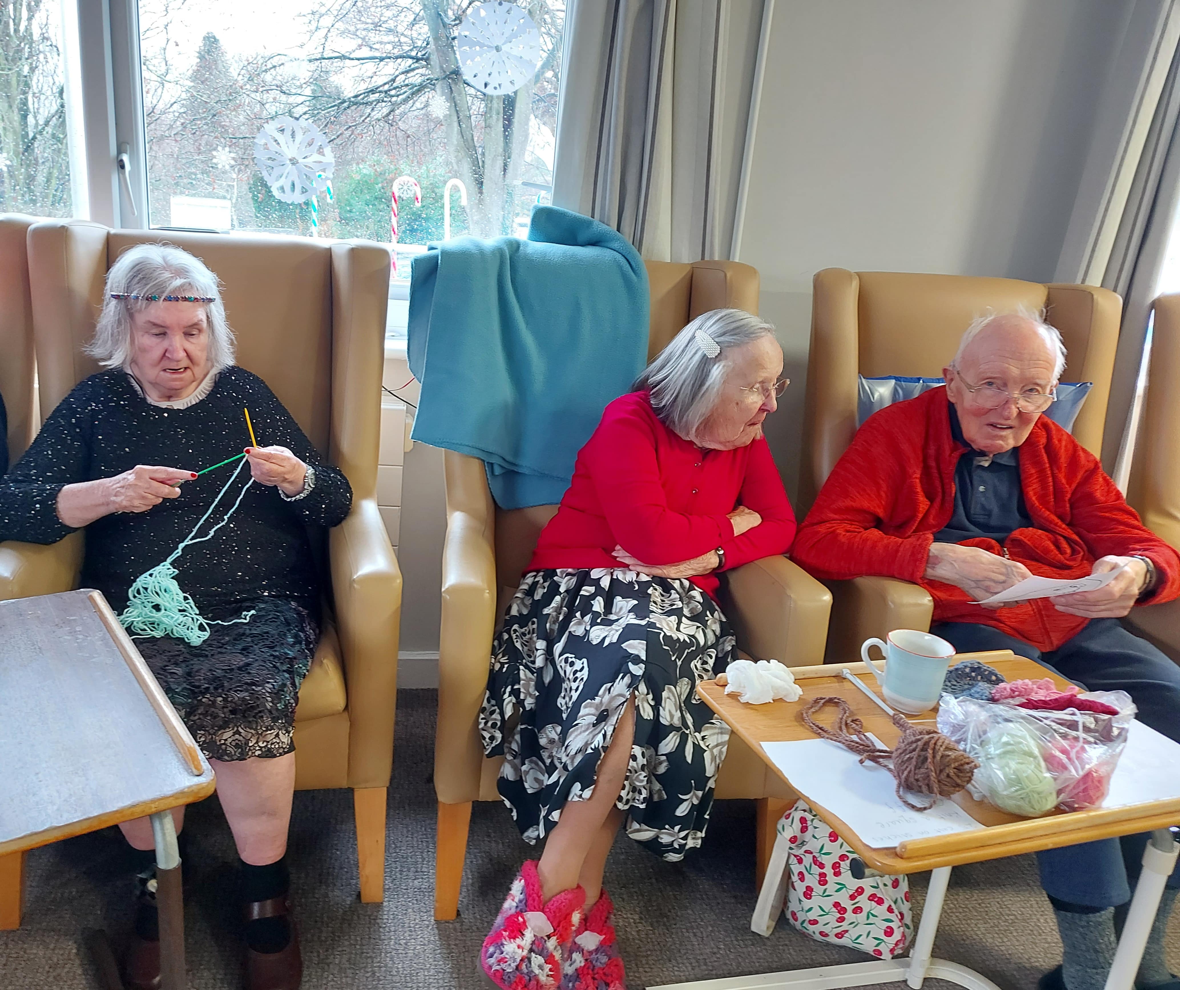 residents knitting a blanket