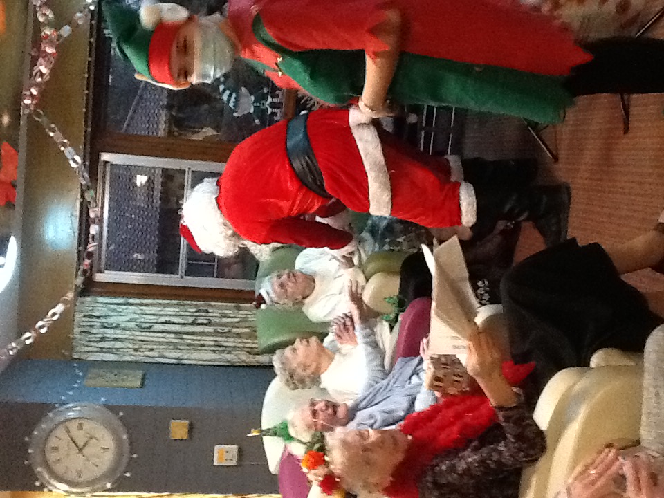 Santa giving presents to residents 