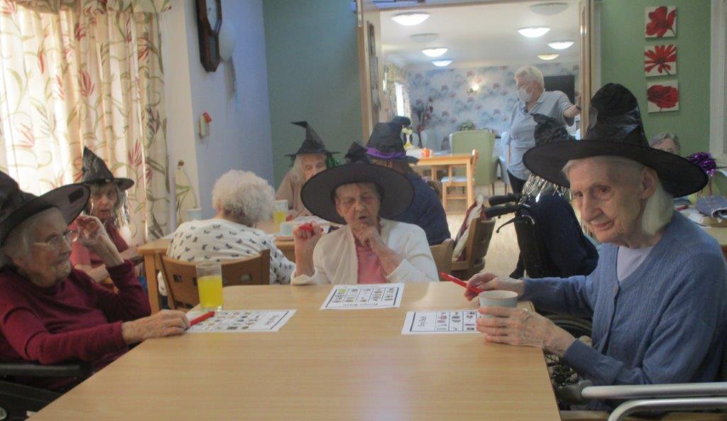 Residents playing Halloween bingo 