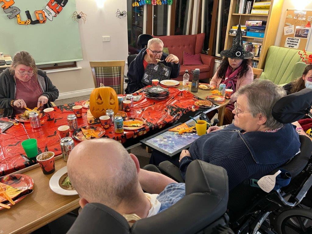 residents enjoying a Halloween feast 