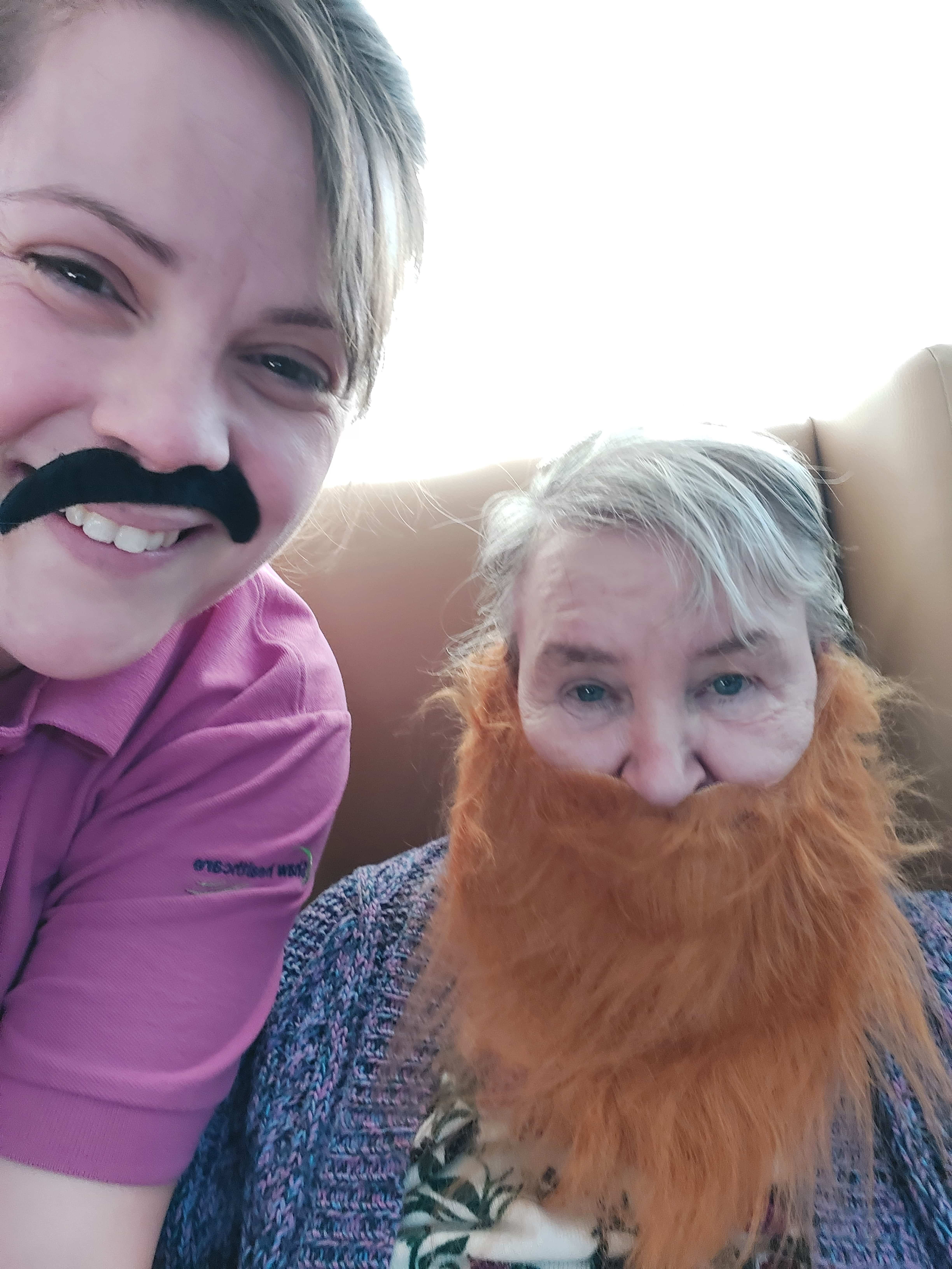 resident and employee with fake beards and moustaches